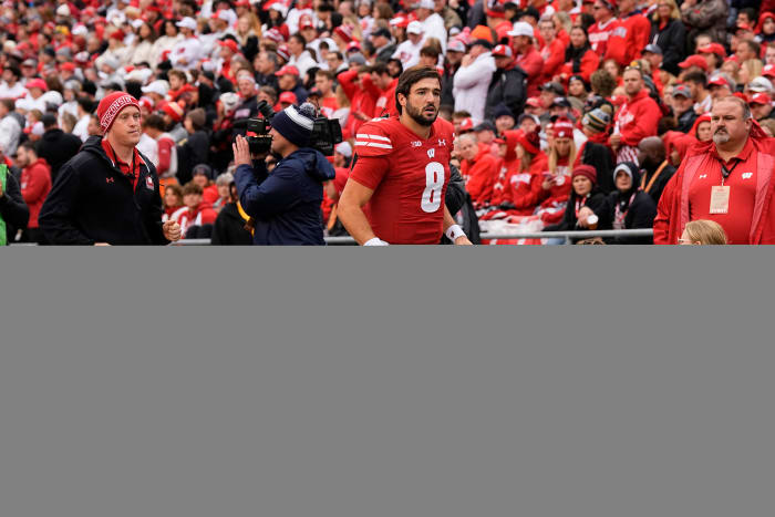 Oct 14, 2023; Madison, Wisconsin, USA; Wisconsin Badgers quarterback Tanner Mordecai (8) runs to the locker room during the second quarter against the Iowa Hawkeyes at Camp Randall Stadium. Mandatory Credit: Jeff Hanisch-USA TODAY Sports